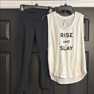 2 piece Fabletics White Graphic Muscle Tee with capri bottoms.